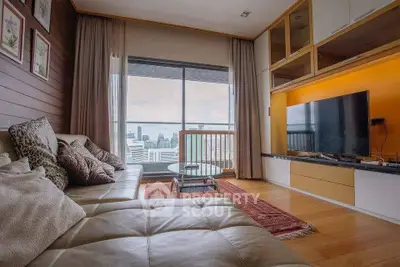 Luxurious living room with stunning city view, modern decor, and cozy seating area.