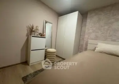 Cozy bedroom with modern decor and ample storage space