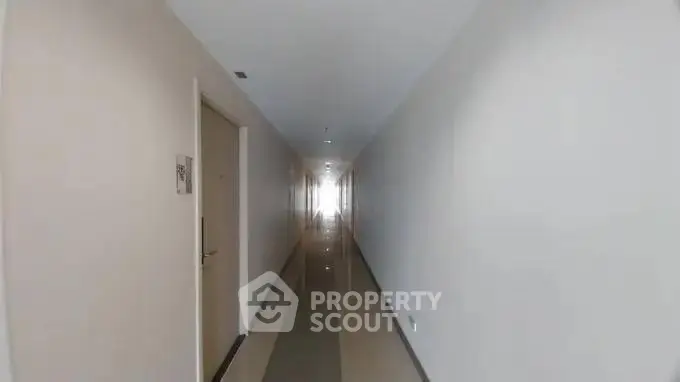 Long hallway in modern apartment building with sleek design