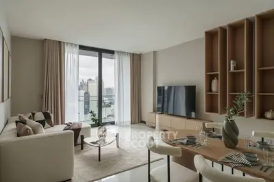 Modern living room with city view, stylish furniture, and elegant decor.
