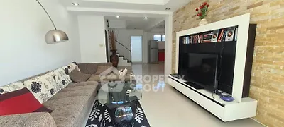 Spacious modern living room with stylish decor and entertainment center