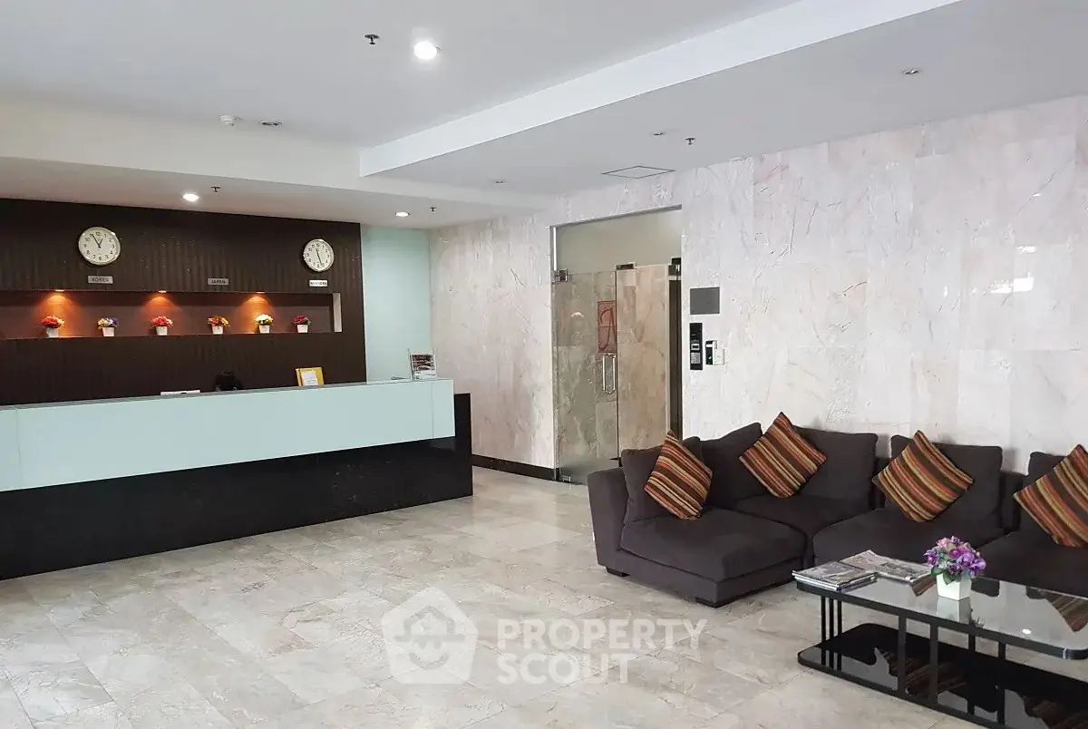 Spacious modern lobby with comfortable seating and elegant reception desk