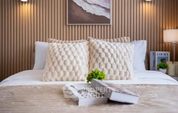 Luxurious bedroom with elegant decor and plush pillows, perfect for relaxation and comfort.