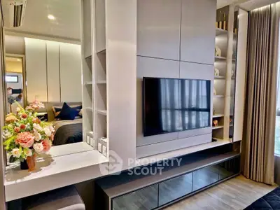 Modern living room with sleek TV setup and elegant decor