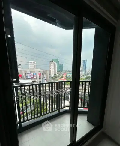 Modern apartment balcony with city skyline view, perfect for urban living.
