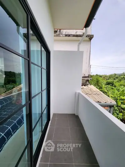 Charming balcony with serene view, perfect for relaxation and enjoying the outdoors.