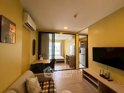 Modern apartment interior with open layout, featuring a cozy living area, stylish bedroom, and sleek kitchen.