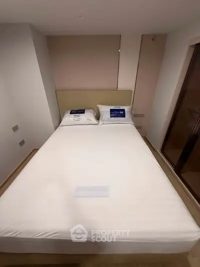 Cozy bedroom with modern design and comfortable double bed in a stylish apartment.