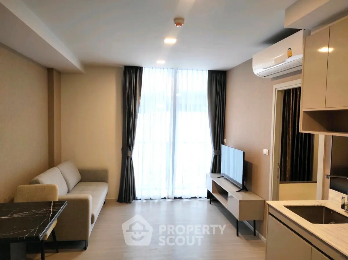 Modern living room with sleek furniture and natural light