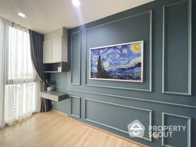 Elegant living room with sophisticated dark blue wall panels and a classic art piece, complemented by natural light from the large window.