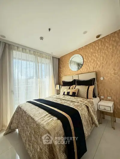Luxurious bedroom with elegant decor and ample natural light