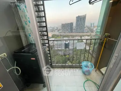 High-rise balcony with city view and laundry area