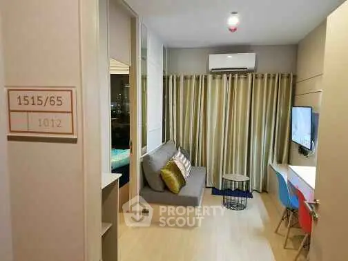 Modern compact living room with stylish decor and natural lighting