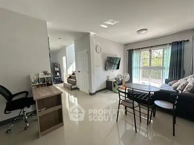 Spacious living room with modern decor and natural light