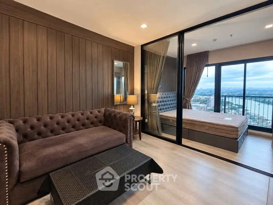 Luxurious living room with elegant sofa and stunning city view from the balcony in modern apartment.