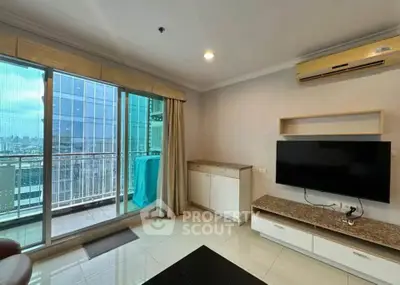 Modern living room with balcony view in high-rise apartment
