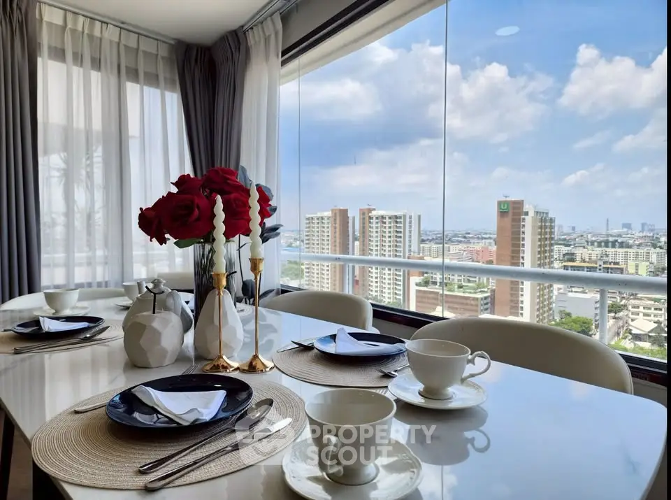 Luxurious dining area with stunning city view, elegant table setting, and floor-to-ceiling windows.