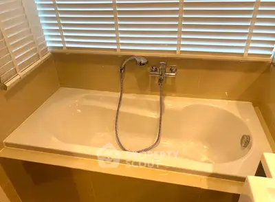 Luxurious bathroom with elegant bathtub and modern fixtures, perfect for relaxation.