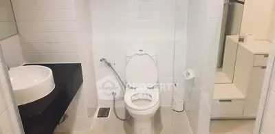 Modern bathroom with sleek fixtures and white tile design