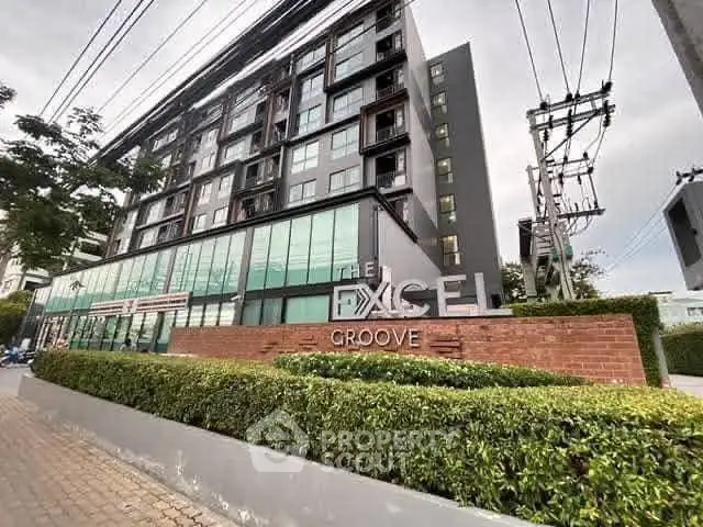 Modern apartment building with sleek design and lush greenery, ideal for urban living.