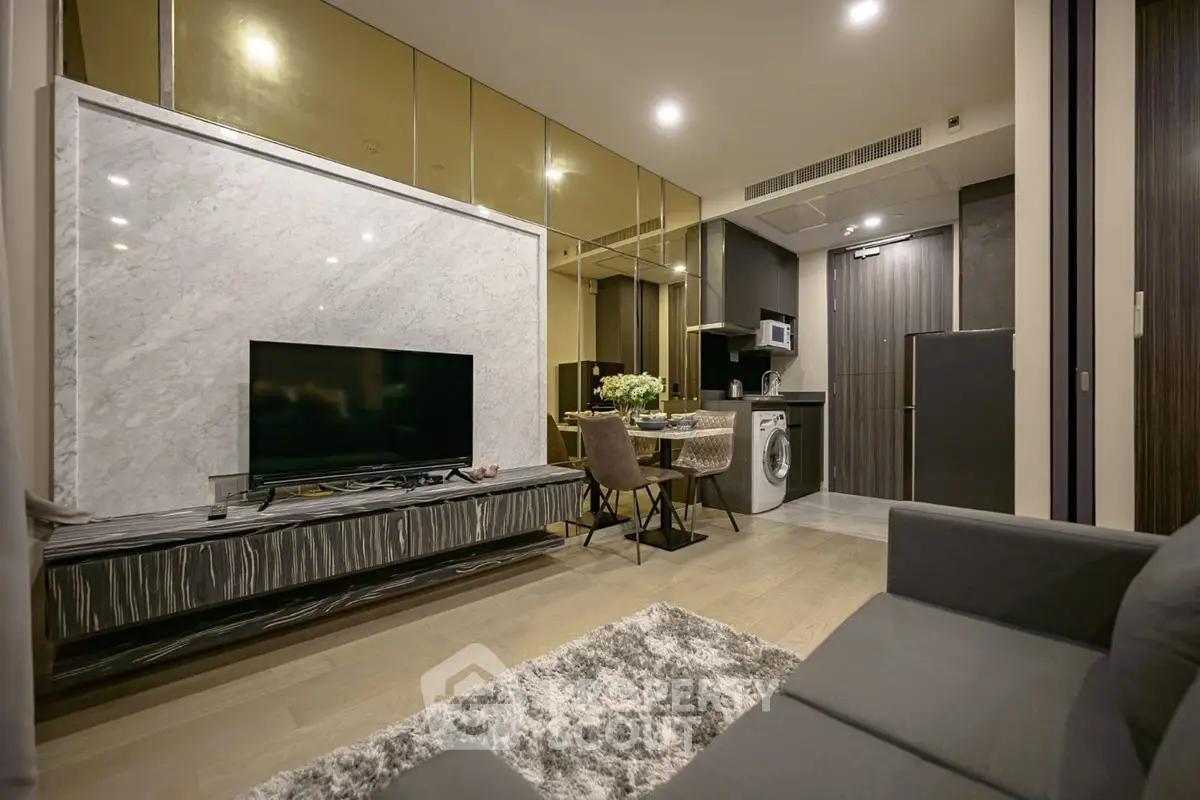 Luxurious modern living room with marble accents and integrated kitchen appliances