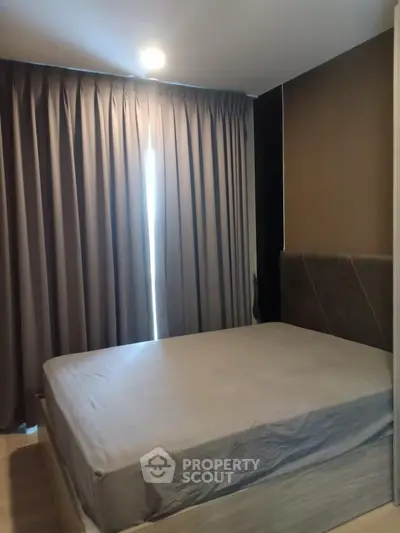 Cozy bedroom with modern design and soft lighting, perfect for relaxation.