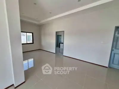 Spacious empty room with glossy tiled floor and modern design