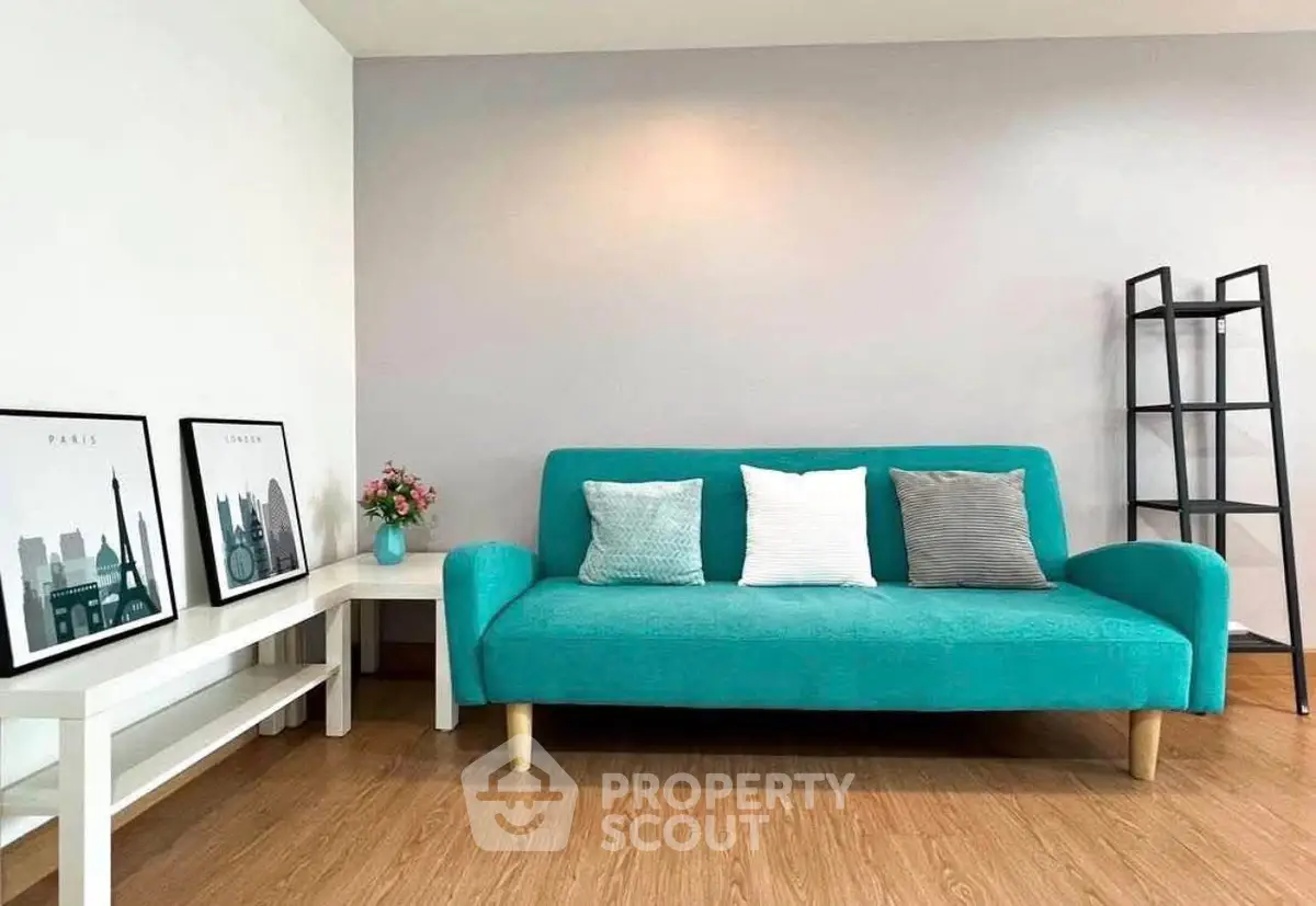 Modern living room with teal sofa and stylish decor