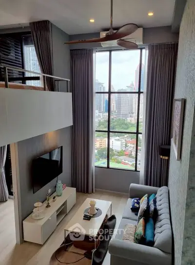 Modern loft living room with high ceiling and city view, featuring stylish decor and large windows.