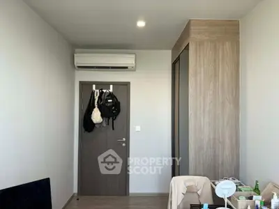 Modern bedroom with air conditioning and built-in wardrobe