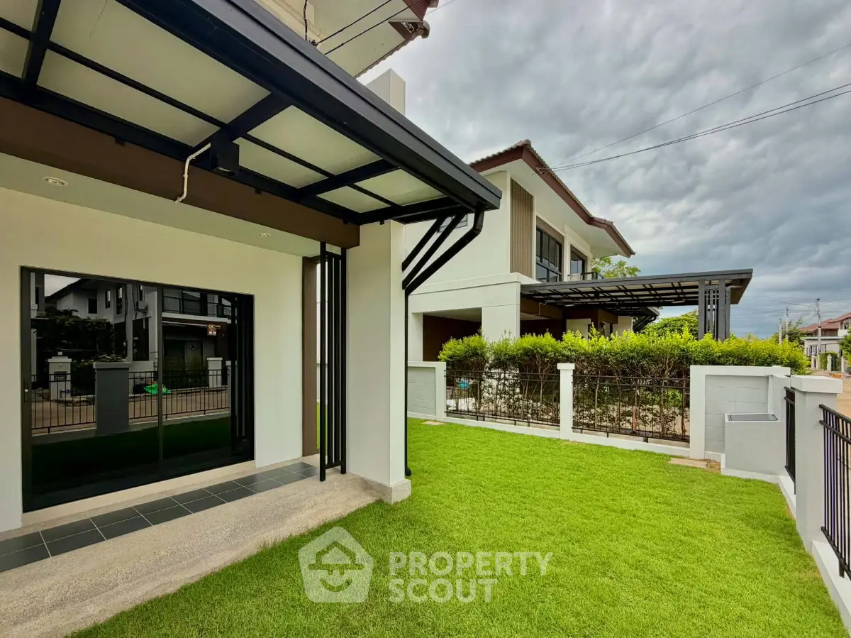 Modern house exterior with lush green lawn and stylish architecture