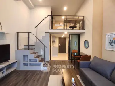 Modern duplex living room with stylish staircase and cozy seating area