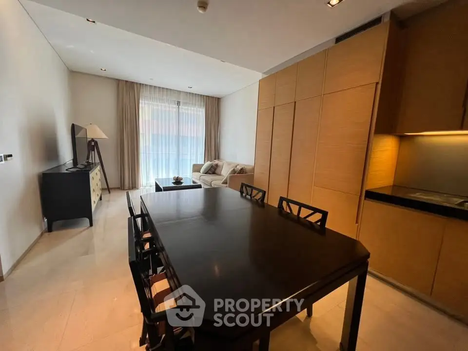Spacious modern living room with dining area and elegant furnishings in a contemporary apartment.