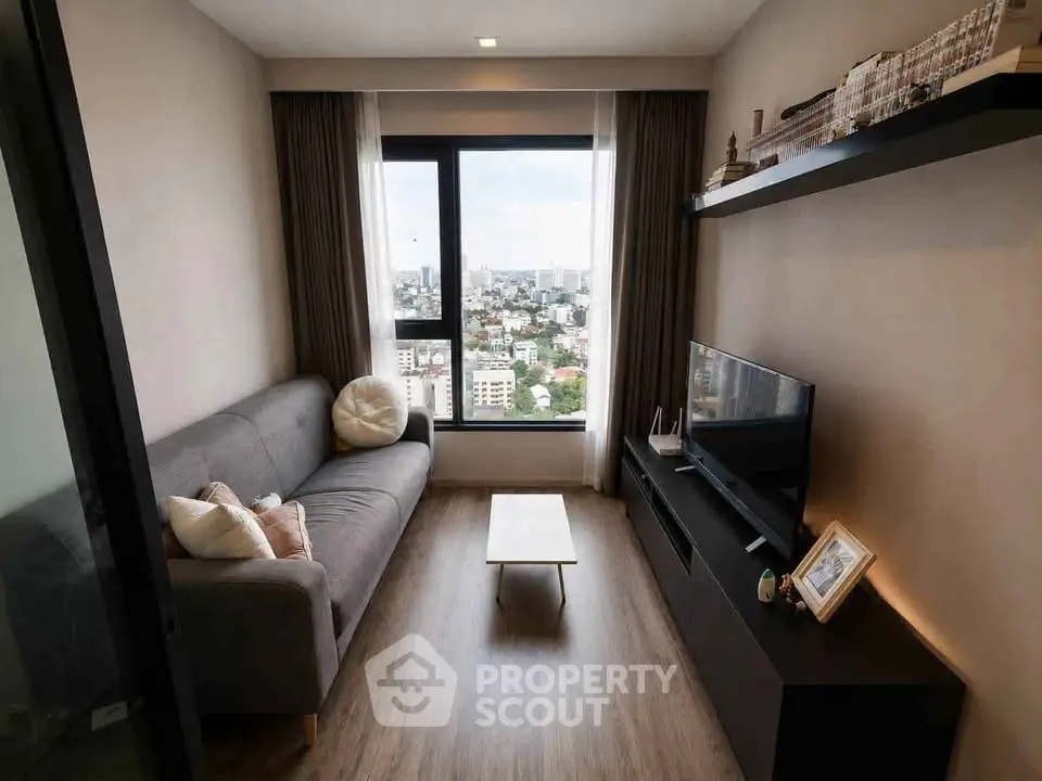 Modern living room with city view, stylish decor, and cozy ambiance.