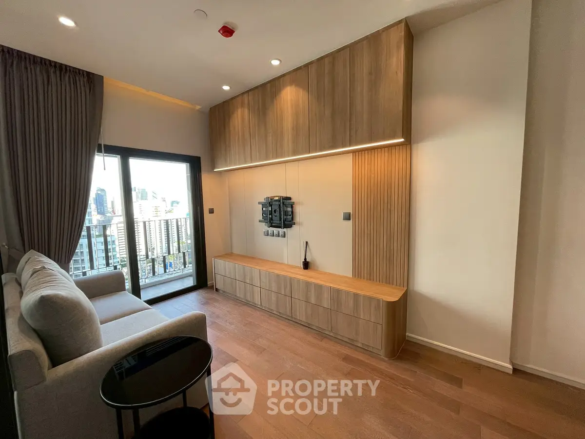 Modern living room with wooden flooring and city view balcony