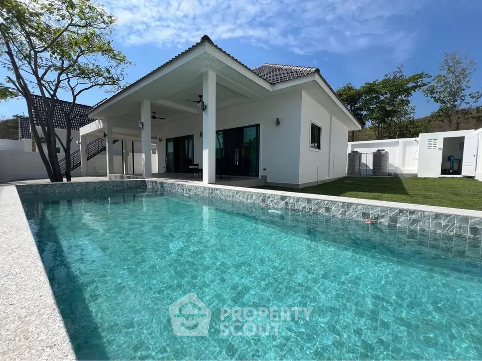 Luxurious villa with private pool and modern architecture in serene setting.