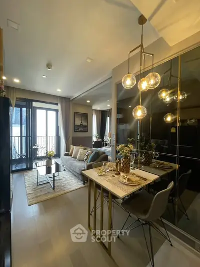 Modern living room with elegant dining area and stylish lighting, featuring a cozy balcony view.