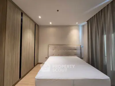 Spacious bedroom with modern design and ample closet space