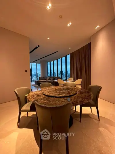 Luxurious modern dining area with stunning city view and elegant marble table.
