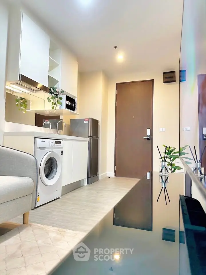 Modern apartment interior with sleek kitchen and cozy living area