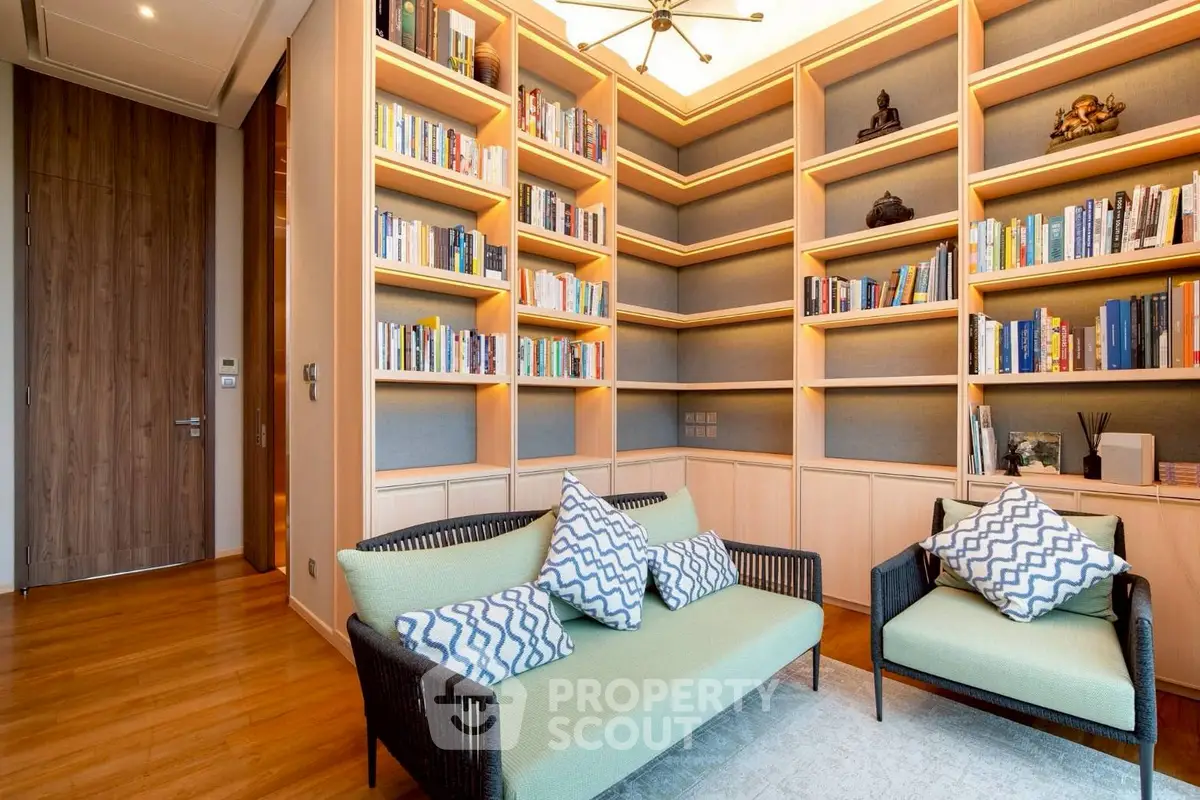 Luxurious home library with elegant bookshelves and cozy seating area