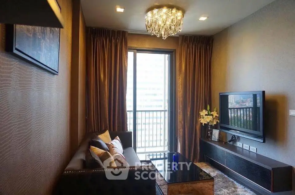 Luxurious living room with elegant chandelier and modern decor in high-rise apartment.