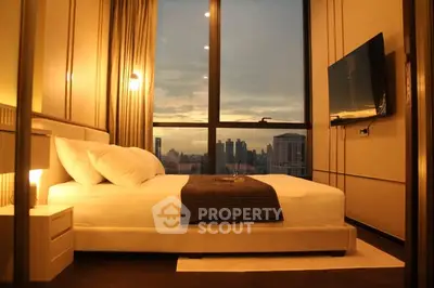 Luxurious bedroom with stunning city view and modern decor