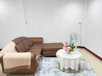 Cozy living room with brown sectional sofa and elegant decor