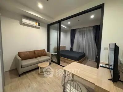 Modern studio apartment with open layout and stylish furnishings