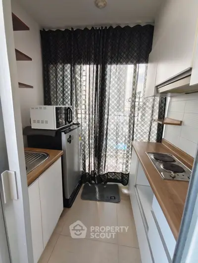 Compact kitchen with modern appliances and open layout