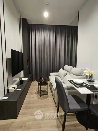 Modern living room with sleek furniture and elegant decor in a cozy apartment setting.
