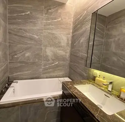 Luxurious bathroom with elegant marble tiles and modern fixtures