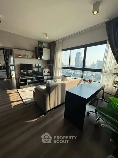 Modern living room with city view, stylish decor, and ample natural light.