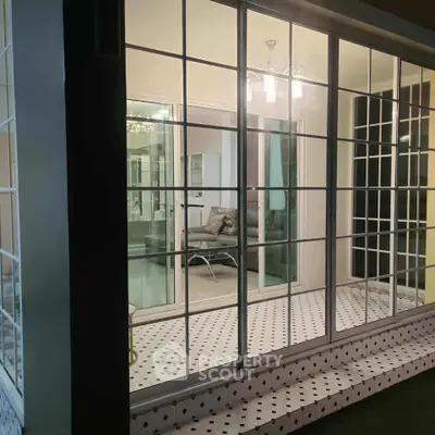 Chic modern living room with glass sliding doors and elegant lighting